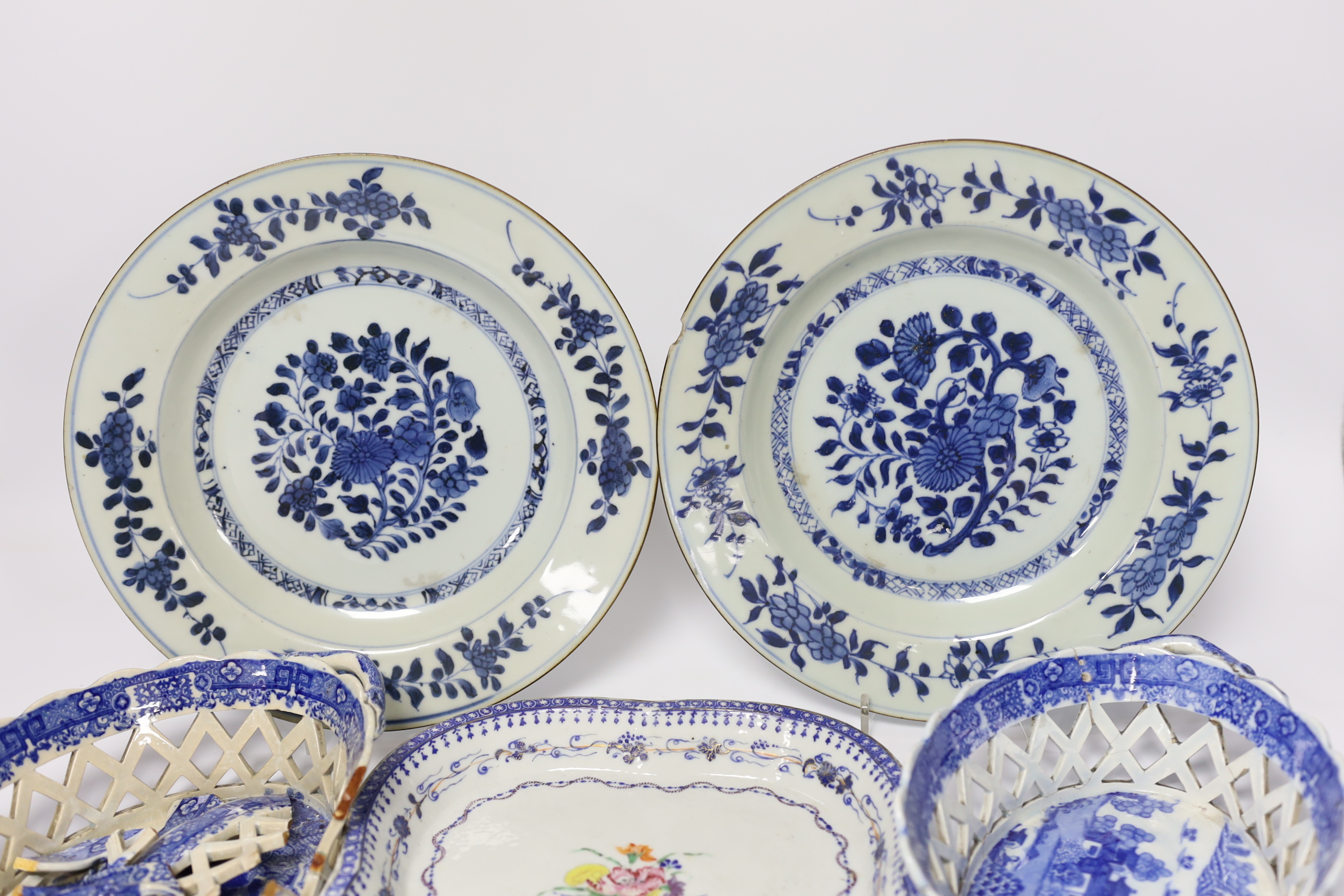 A Chinese porcelain serving dish and a pair of plates, and a pair English blue and white chestnut baskets, largest 23cm diameter (a.f.)